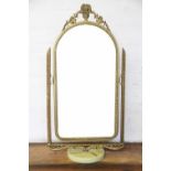 A continental gilt metal and onyx dressing table mirror,