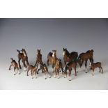 A collection of eight Beswick foals and three Beswick pony's, of various prancing forms,