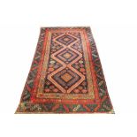 A Caucasian wool rug, with geometric detailing, 199cm L x 106cm W, with a red ground runner,