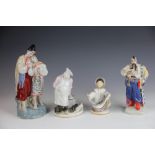 A Russian Polonye figure of a robed man with pipe in traditional dress 22cm high and another of