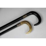 Two horn mounted walking sticks, silver collars for Chester 1912, 85cm long and London 1923,