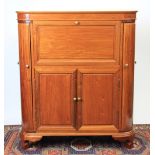 A Chinese carved hardwood cocktail cabinet, the top and front revealing a fitted interior,