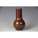 A 19th Chinese brown glazed porcelain vase, the sang de boeuff type glaze with flambe finish,
