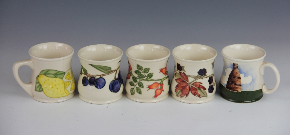 Five Moorcroft mugs, decorated with plums, lemons, rose hips,