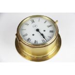 A German lacquered brass bulkhead timepiece, Roman numeral dial with subsidiary seconds,