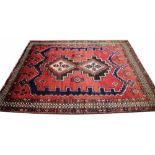 A Persian hand woven Qashqai wool carpet,