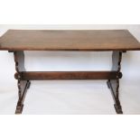A 1920's oak refectory type table, on standard end supports,