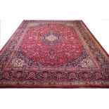 A large Kashan hand woven wool carpet,