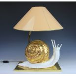 A pair of novelty ceramic lamps modelled as snails, on brass rectangular bases,