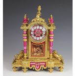 A 19th century French ormolu eight day mantel clock, set with Sevres style pink porcelain mounts,