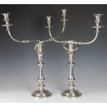 A pair of silver plated candlesticks, 19th century,