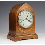 An Edwardian inlaid mahogany lancet shape mantle clock, with movement striking on two gongs,