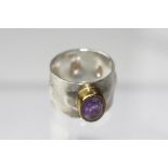 An artisan made amethyst set ring,