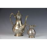 A silver coffee pot and milk jug, Goldsmiths and Silversmiths Company, London 1905,
