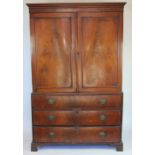 A George III mahogany linen press, with two doors enclosing five press trays,