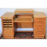 A light oak architects type desk, with sprung mechanism,