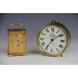 An American Ansonia brass alarm clock 'Rouser', with Roman numeral dial, 15cm diameter,
