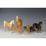 A Beswick Palamino mare, 20cm high, Palamino colt, 15cm high and a Palamino foal,