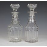 A pair of Regency cut glass decanters and stoppers, with bollection cut detail and star cut base,