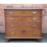 A George III oak chest, of two short and three long drawers, on bracket feet,