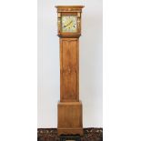 A 1920's eight day golden oak grandmother clock,