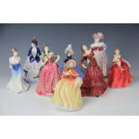 A collection of Royal Doulton and Coalport figures, comprising Royal Doulton HN 5323 Pretty Ladies,