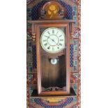 An Austrian inlaid walnut regulator, with Roman numeral dial and movement striking on a bell,