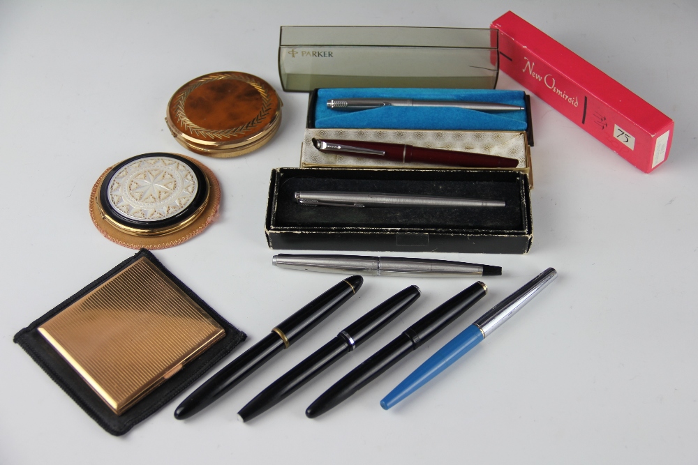 A collection of pens and powder compacts, to include; a Platignum Varsity De Luxe and a Regal,