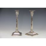 A pair of 19th century silver plated candlesticks, with detachable square nozzles,