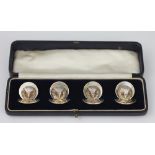 Four George V silver owl menu holders, on circular bases, Samson Mordan & Co, two are London 1919,