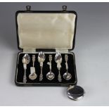 A Victorian silver circular vesta case, London 1895, with a cased set of six silver tea spoons,