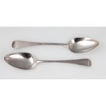 A pair of late George II Old English Pattern silver spoons, makers initials R:H,