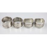 A pair of silver napkin rings, Birmingham 1930, with two other napkin rings, 2.