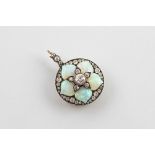 An opal and diamond set brooch/pendant circa 1910, the circular pendant in flower head design,