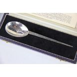 An A E Jones hammered silver christening spoon, a replica of a 4th century Roman spoon,