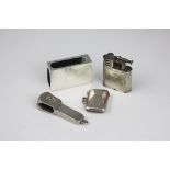 A Dunhill lighter 'Pat No 288806', 5cm high along with a silver cigar cutter,