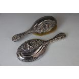 A silver backed dressing table brush and hand mirror, Walker and Hall,