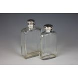 Two silver topped glass flasks, each with bayonet silver cap, to include; Joseph Braham,