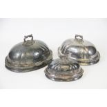 A graduated set of three 19th century silver plated covers,