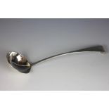 A large Irish silver ladle, Dublin 1758, probably Alexander Richards, engraved crest, 34cm long,