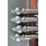 A modern set of four green and gilt painted curtain poles from Cameron Fuller Devon,