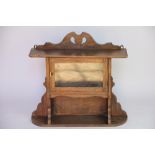 An Edwardian oak hanging cabinet,