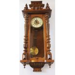 A walnut Vienna regulator wall clock, with carved crest,