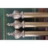 Three modern gilt pine curtain poles from Cameron Fuller Devon, with turned and fluted ends,