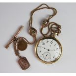 A gold plated pocket watch with attached decorative albert chain,