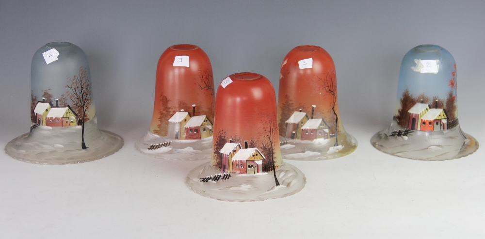A set of three Continental painted glass light shades, decorated with a cottage at sun rise,