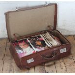 A vintage leather suitcase initialled 'L.