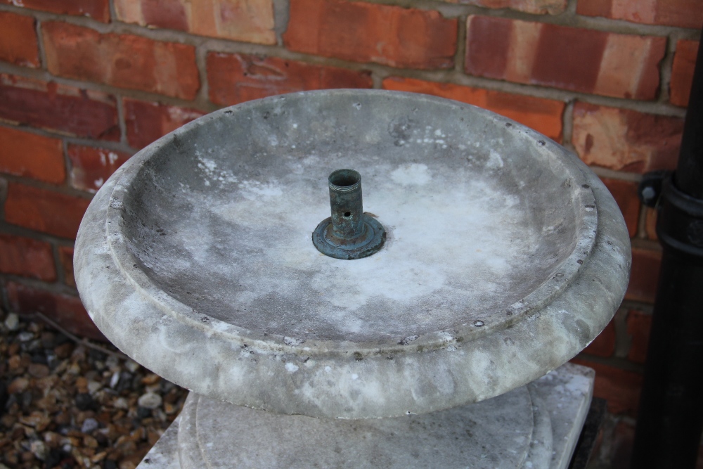 A garden marble water fountain, on associated pierced cast iron stand, 69cm H x 43cm diameter, - Bild 2 aus 2