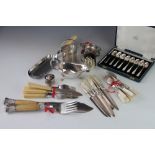 An assortment of silver plated cutlery and flatware,