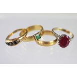 An 18ct yellow gold band weight 2.8gms, an 18ct yellow gold band with green stone inset, weight 3.